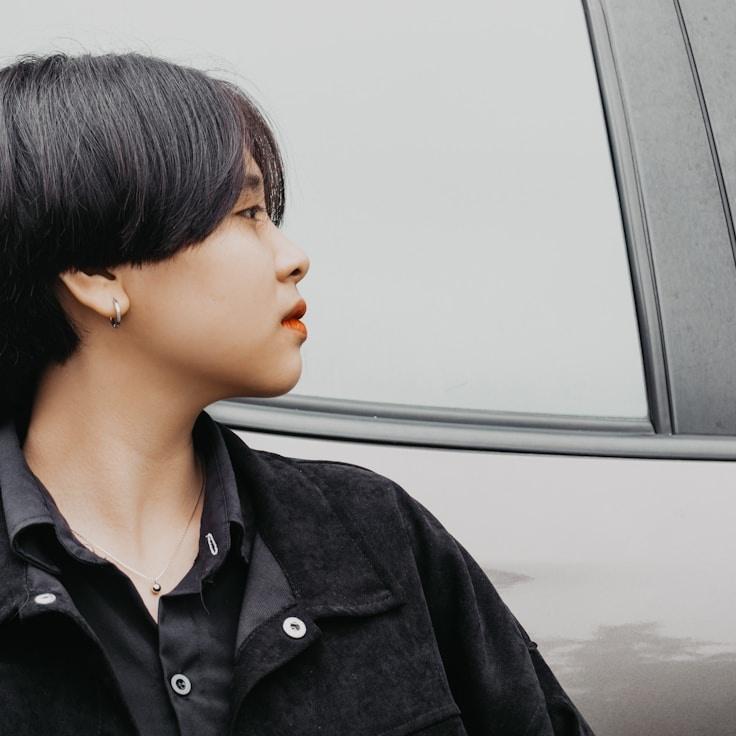 Jordan Lee, Lead Design Curator at TrailHarborLedger, reviewing corporate floral arrangements